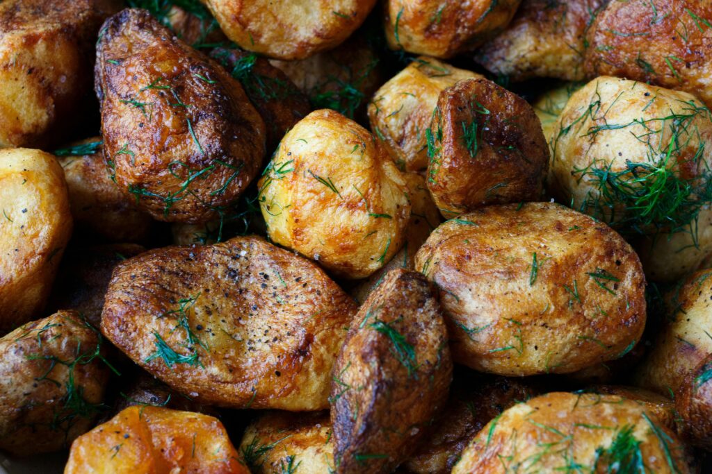 Deliciously crispy roasted potatoes seasoned with dill and spices.