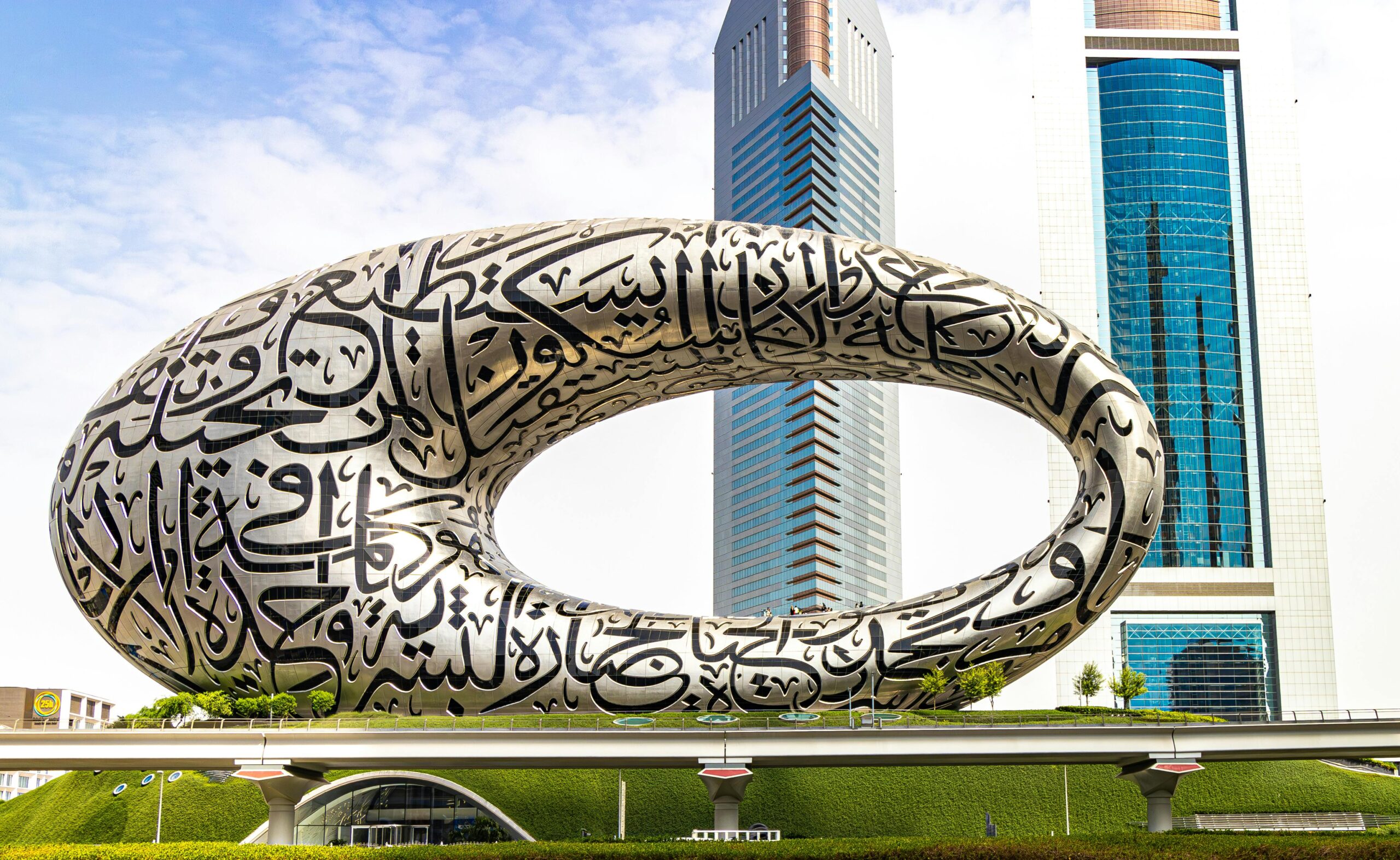 Stunning view of the Museum of the Future in Dubai with skyscrapers in backdrop.