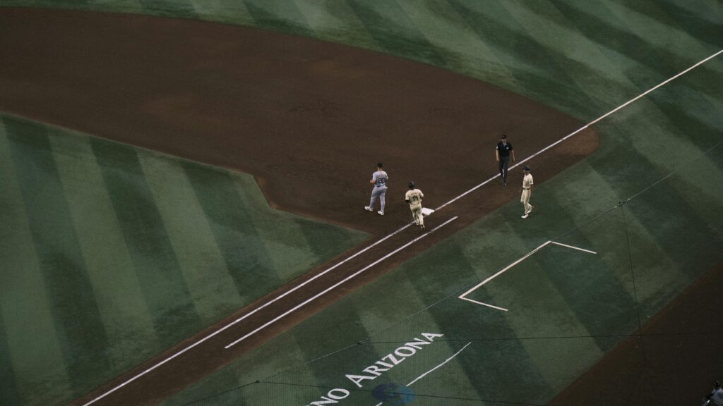Baseball players on field at Chase Field, Arizona, captured from above.
